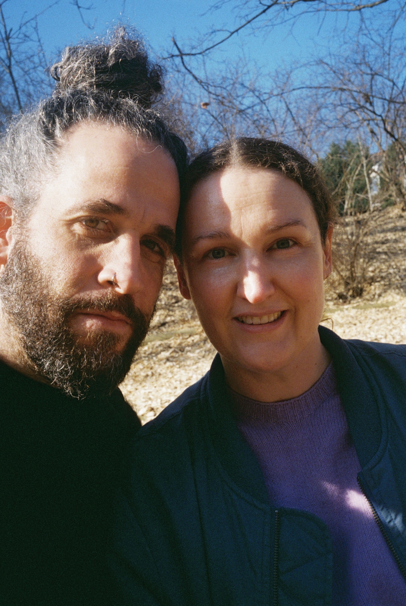 Jonatan and Tarinii, heads together, winter sun